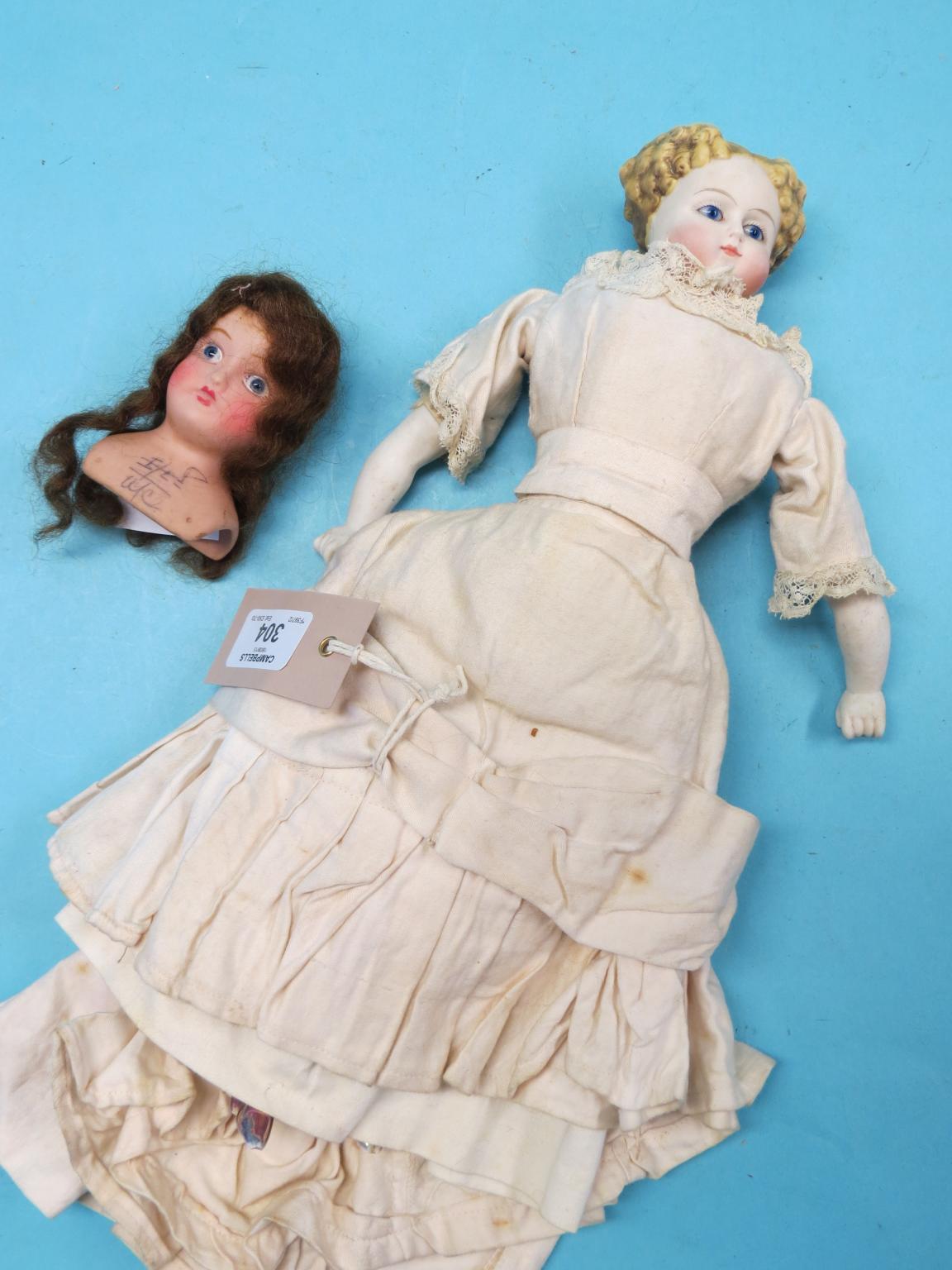 Appraisal: A late th century German shoulder-bisque doll with ceramic lower-limbs