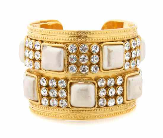 Appraisal: A Chanel Goldtone Oversized Cuff clear stones and faux cabochon