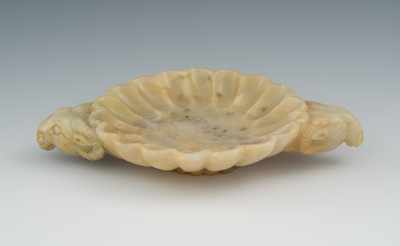 Appraisal: A Carved Hardstone Brush Wash The circular fluted shallow dish