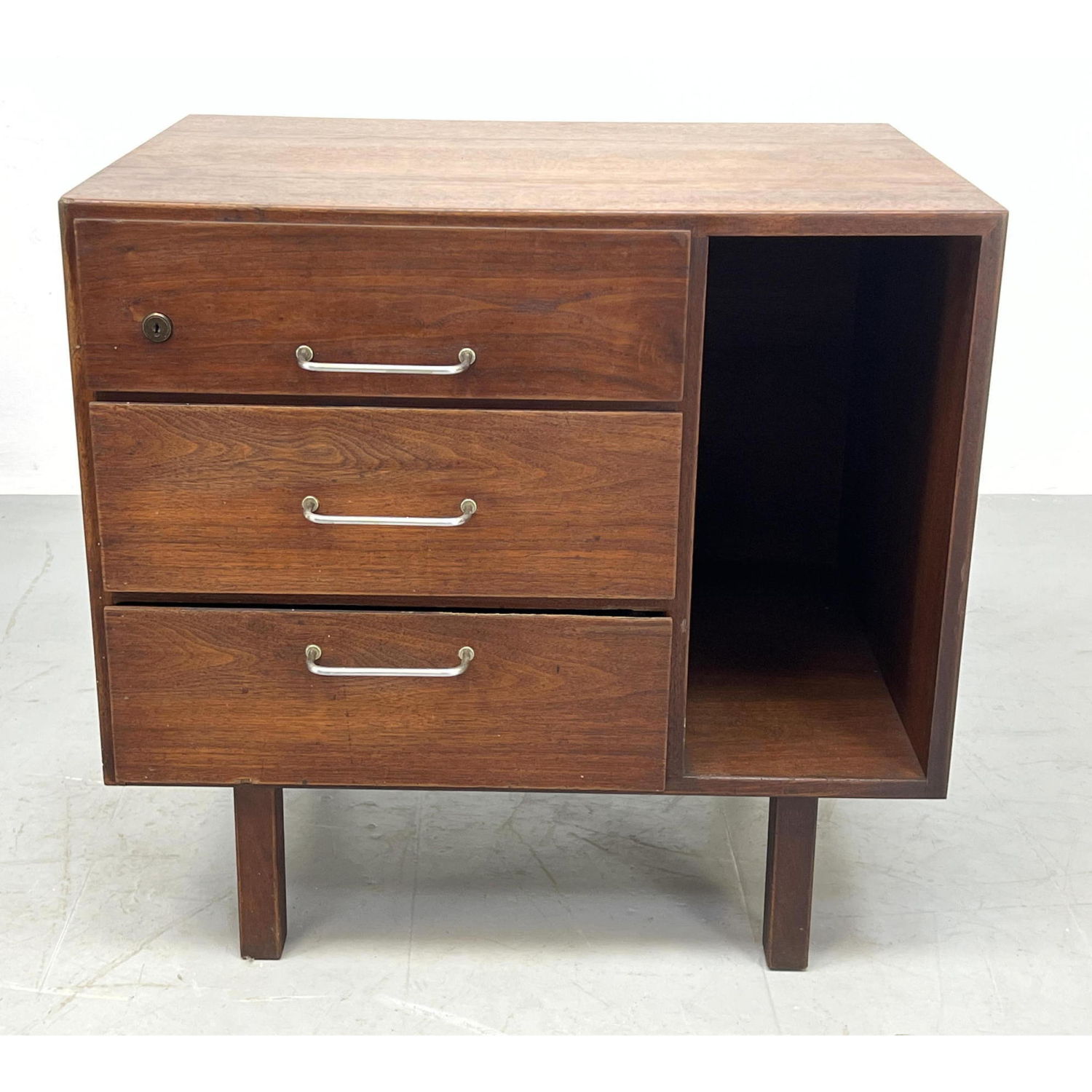 Appraisal: JENS RISOM American Modern Walnut Cabinet Three drawers with side