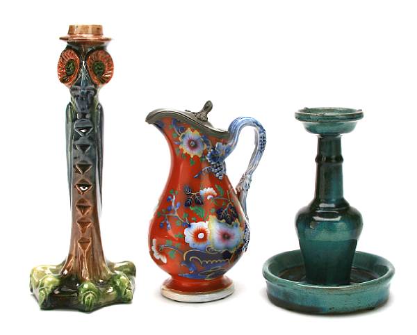 Appraisal: A pair of majolica owl form candlesticks together with another