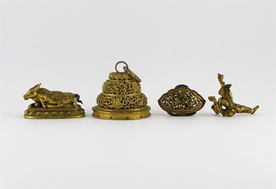 Appraisal: Four gilt bronze items including the bull from a figure