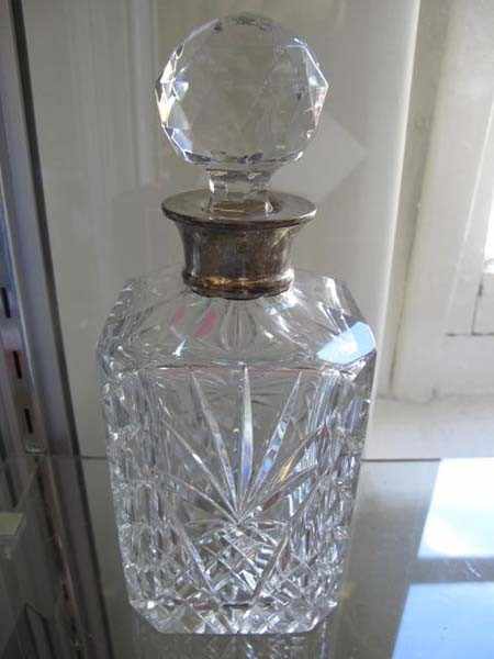 Appraisal: CUT CRYSTAL STERLING SIVLER MOUNTED DECANTER MINOR CHIPS TO STOPPER