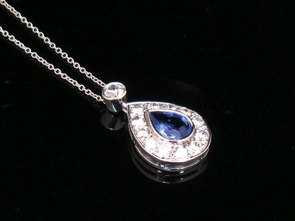 Appraisal: A SAPPHIRE AND DIAMOND DROP PENDANT set to the centre