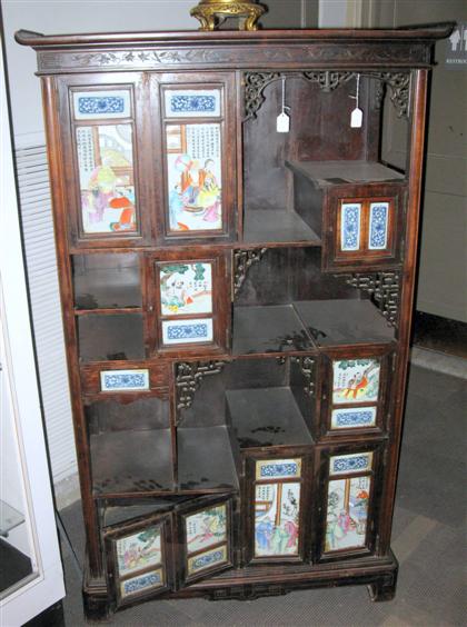 Appraisal: Chinese softwood porcelain insert display cabinet Of tall rectangular form