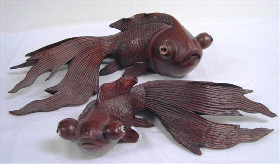 Appraisal: Two Asian carved wood figures of carp glass eyes some