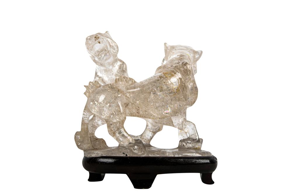 Appraisal: CARVED ROCK CRYSTAL LION GROUPset atop wood base inches total