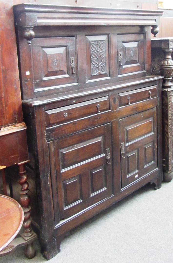 Appraisal: A th century oak court cupboard with pair of carved