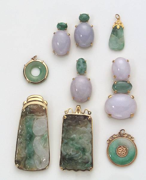 Appraisal: A collection of nine jade and k gold pendants