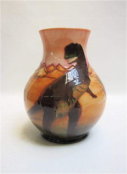 Appraisal: MOORCROFT POTTERY VASE hand painted under glaze in Dinosaur motif