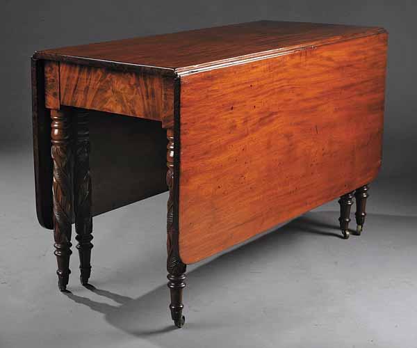 Appraisal: An American Late Classical Carved Mahogany Drop-Leaf Dining Table c