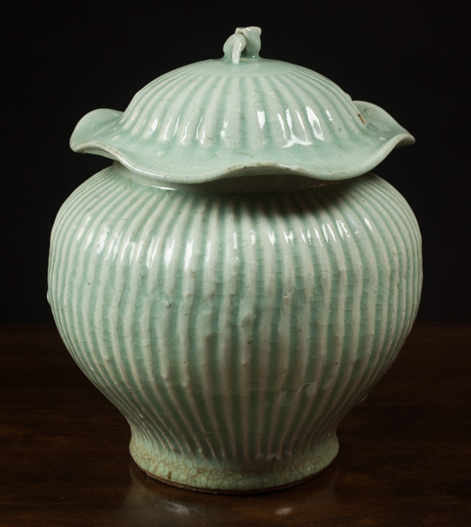 Appraisal: CHINESE CELADON GLAZED POTTERY STORAGE JAR with bean sprout lid