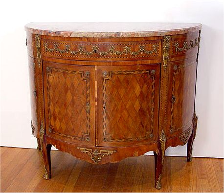 Appraisal: FRENCH ORMOLU MARBLE TOP COMMODE Marble top over parquetry inlay