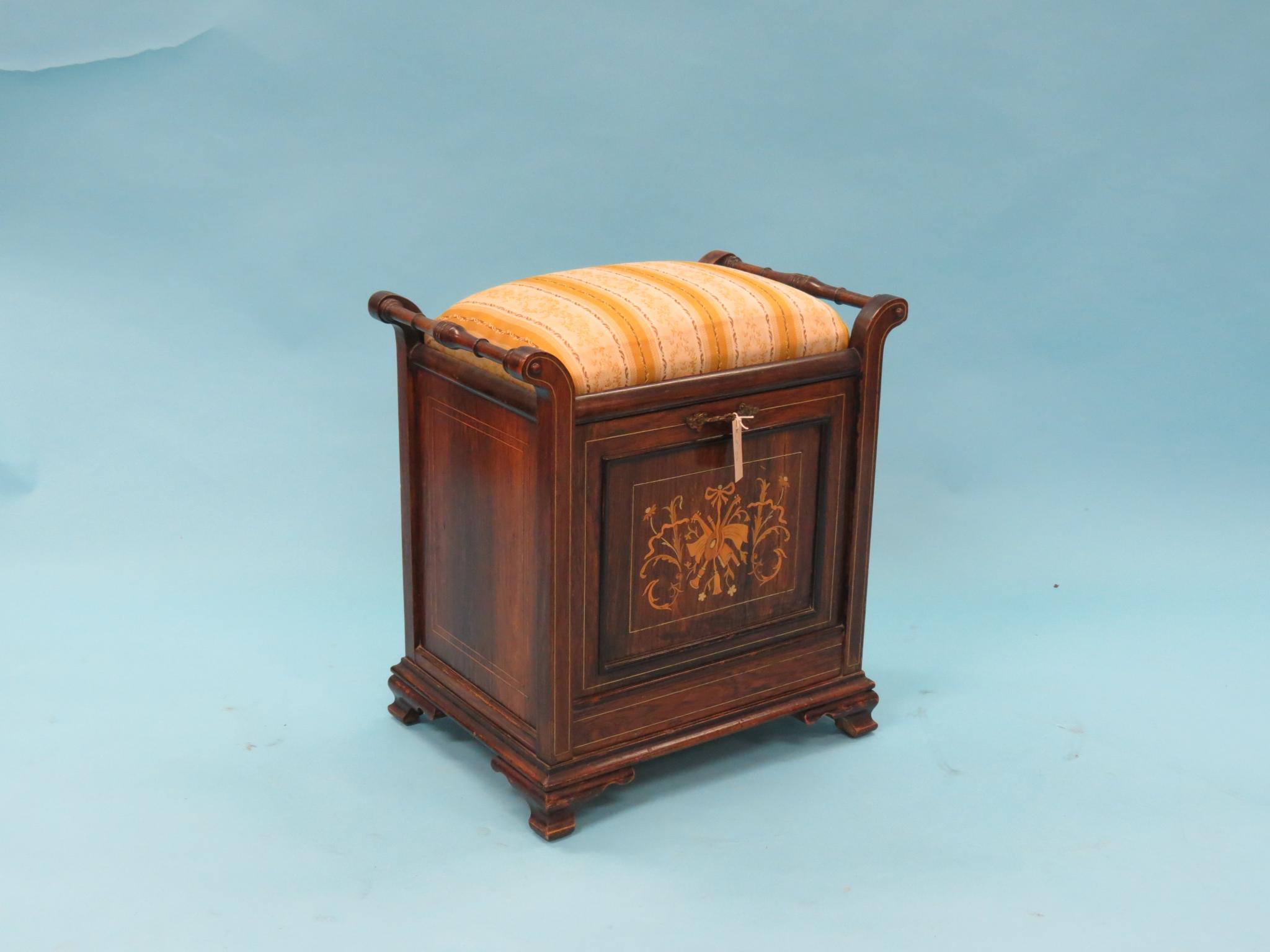 Appraisal: An Edwardian rosewood piano stool padded seat above marquetry fall-front