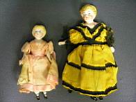 Appraisal: GERMAN BISQUE DOLL HOUSE DOLLS Original dress piece jointed one