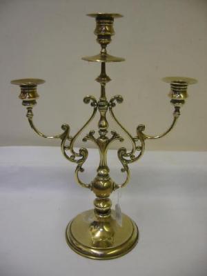 Appraisal: A VICTORIAN BRASS THREE LIGHT CANDELABRUM the urn shaped sconces