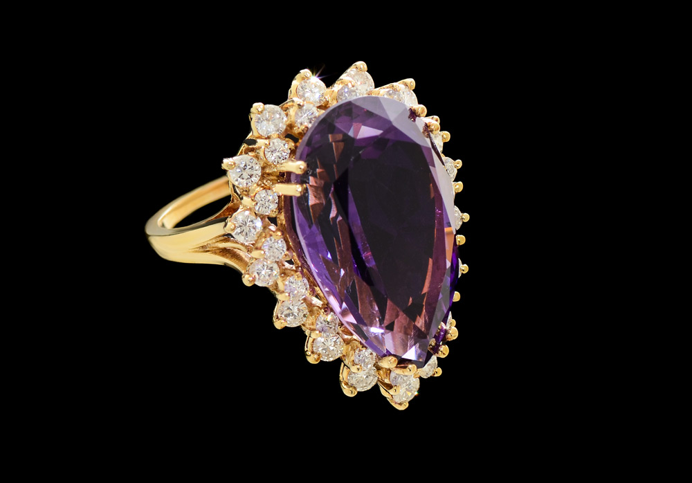 Appraisal: K AMETHYST AND DIAMOND RING A large pear shaped amethyst