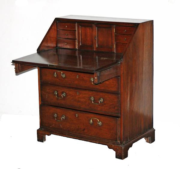 Appraisal: A George III mahogany slant front desk height in width