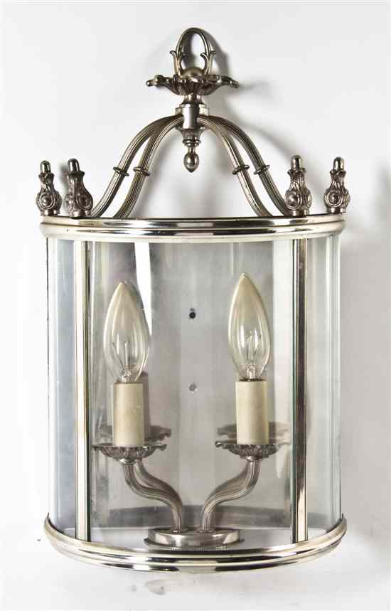 Appraisal: A Silvered Metal Two-Light Sconce of demilune form with glass