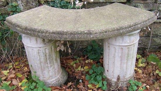 Appraisal: A bowfront garden seat on fluted supports cm '' wide