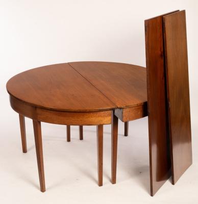 Appraisal: A mahogany dining table on square tapering legs extendable with