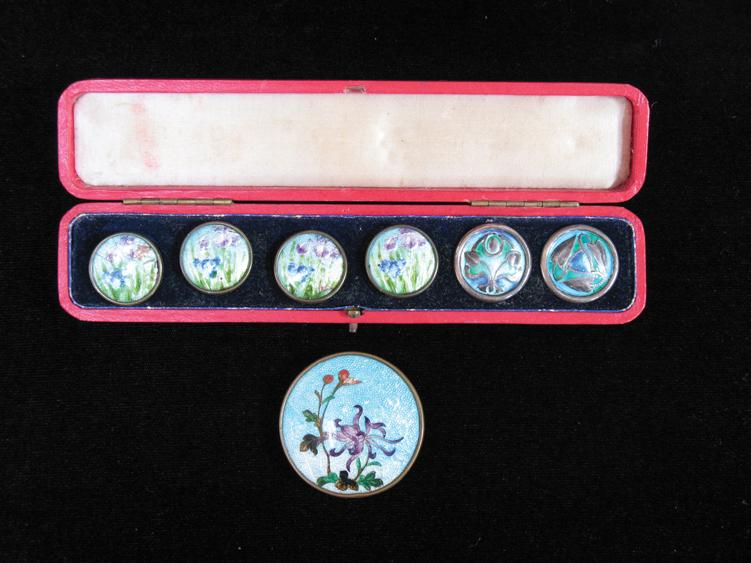 Appraisal: A CASED SET OF ART NOUVEAU ENAMELLED BUTTONS each depicting