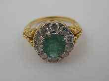 Appraisal: A yellow metal tests ct gold diamond and emerald ring