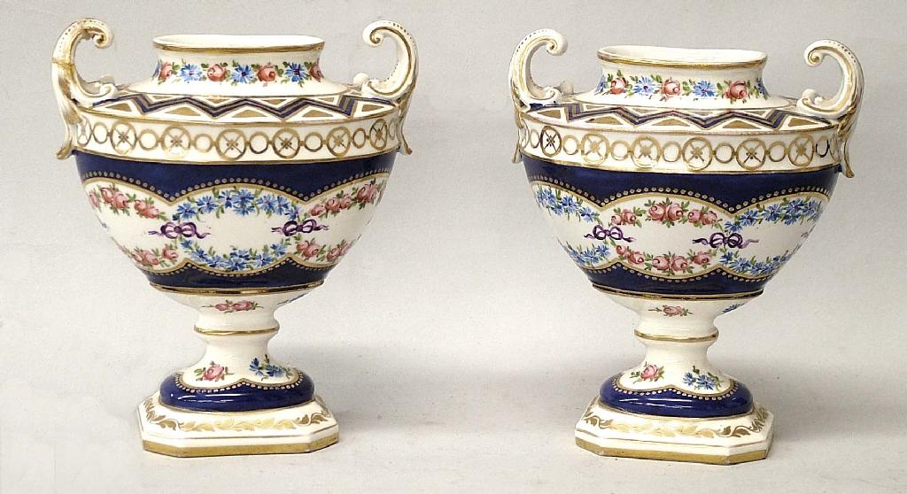 Appraisal: Pair of Sevres style urn shaped vases with twin flying