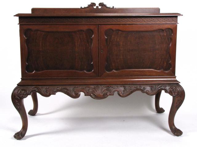 Appraisal: Pair of carved walnut antique Chippendale-style linen chests on carved