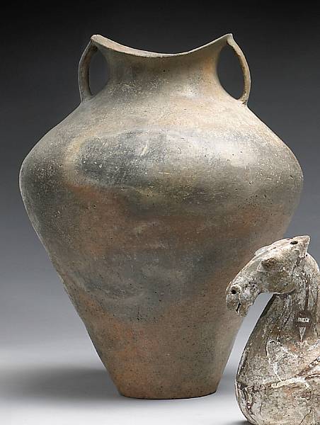 Appraisal: A large neolithic grey pottery jar The thinly walled container