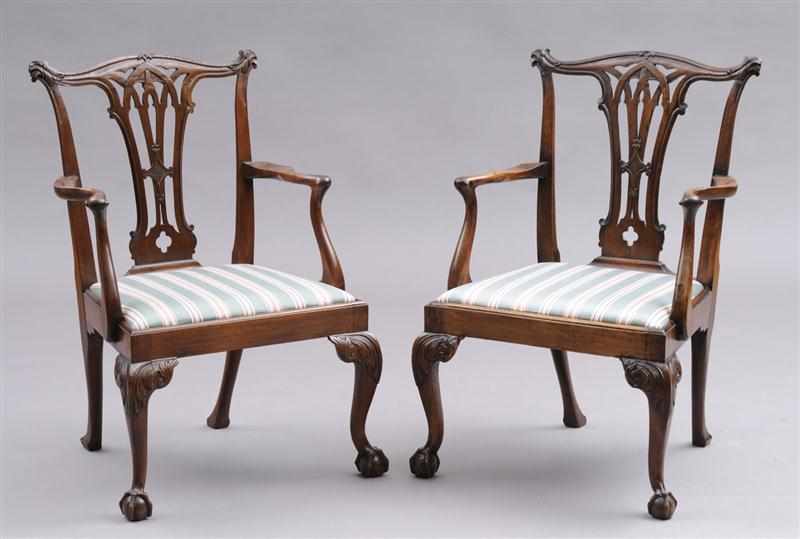 Appraisal: PAIR OF GEORGE III CARVED MAHOGANY OPEN ARMCHAIRS Each with