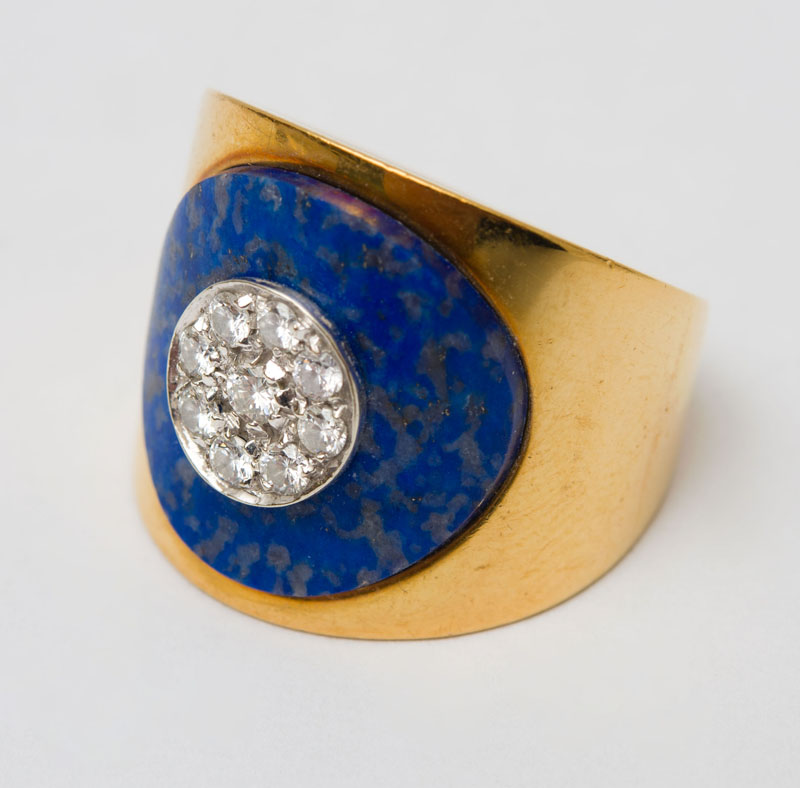 Appraisal: GOLD SODALITE AND DIAMOND RING Wide band centering a circle