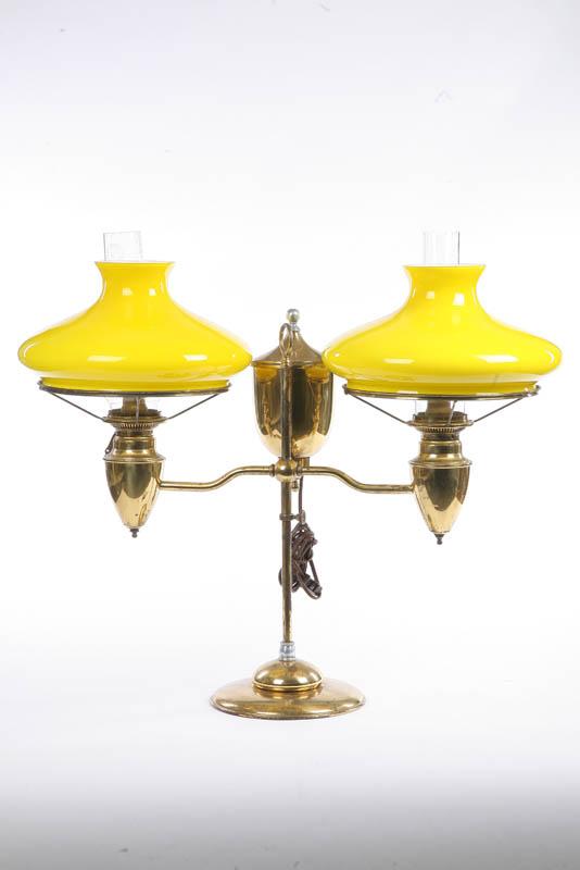 Appraisal: BRADLEY HUBBARD DOUBLE STUDENT LAMP Brass with a central reservoir