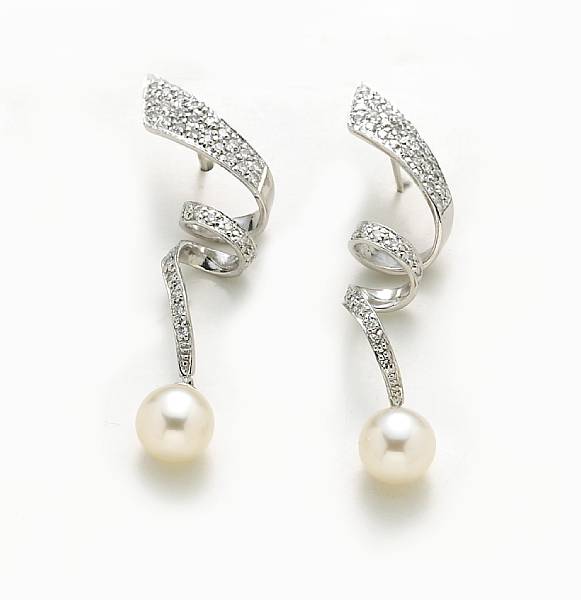 Appraisal: A pair of cultured pearl diamond and platinum earrings cultured