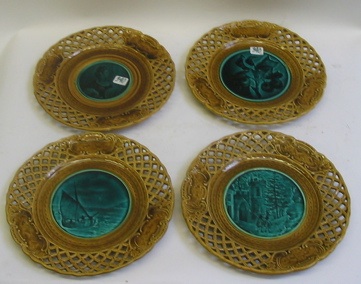 Appraisal: A SET OF FOUR MAJOLICA POTTERY PLATES having a green