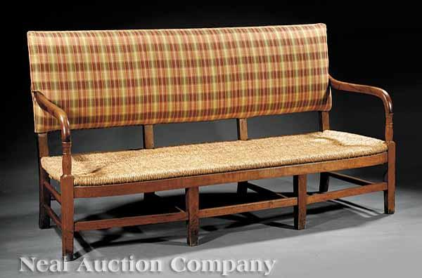 Appraisal: An Antique Continental Carved Fruitwood Bench th c with upholstered