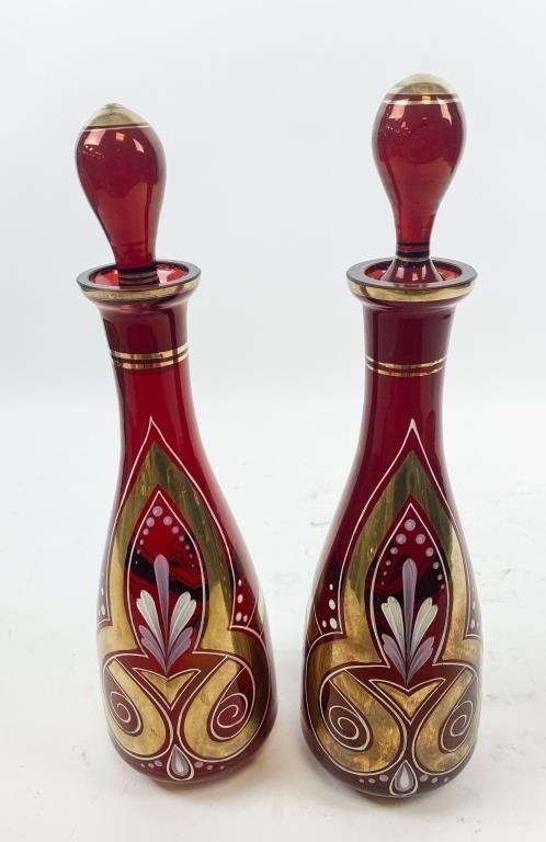 Appraisal: PAIR OF BOHEMIAN RUBY GLASS DECANTERSPair of Bohemian ruby glass