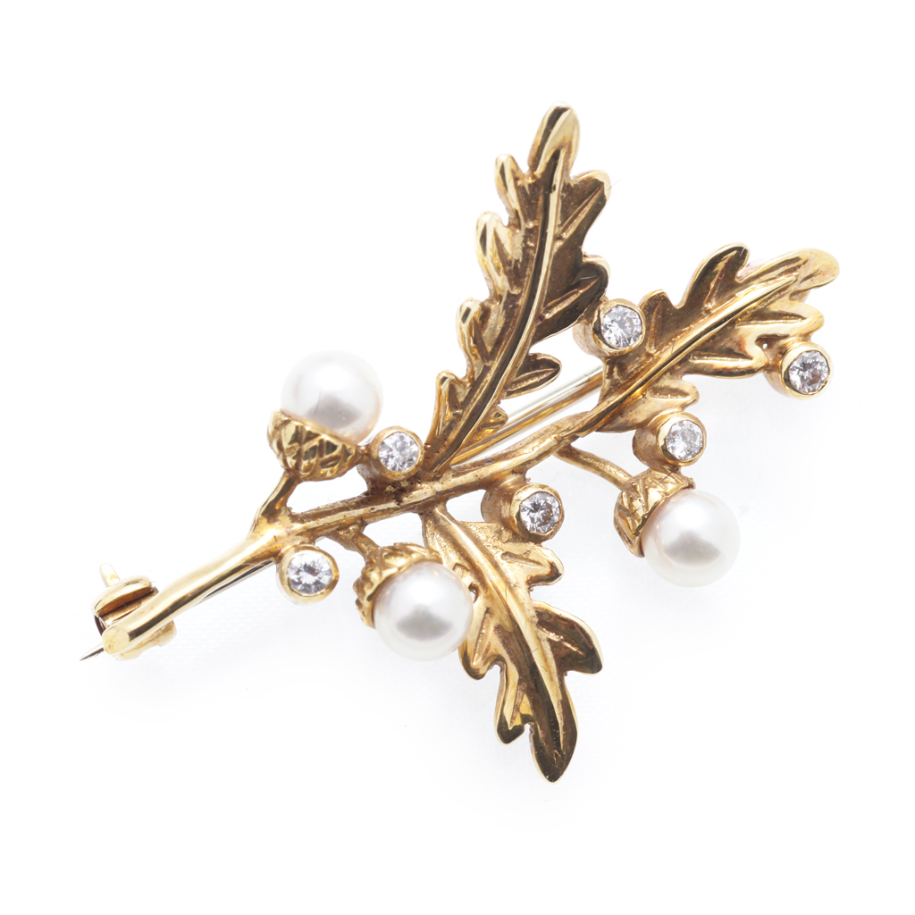 Appraisal: A diamond and pearl set brooch modelled as an oak