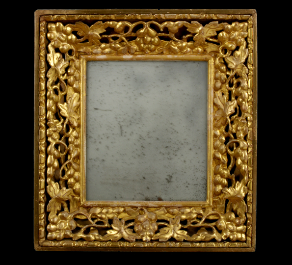 Appraisal: Italian Carved Giltwood Looking Glass early th century the rectangular