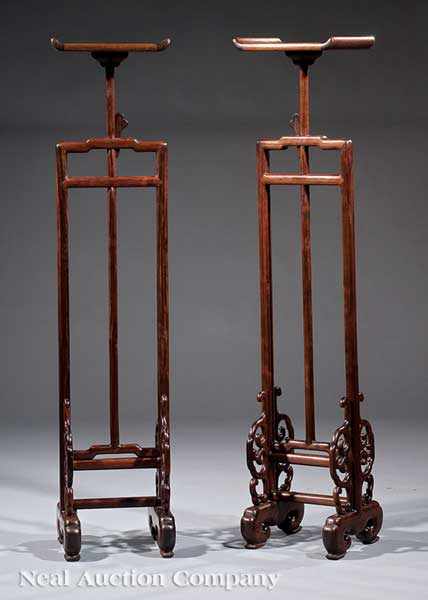 Appraisal: A Pair of Chinese Hardwood Candlestands scroll shelf on adjustable