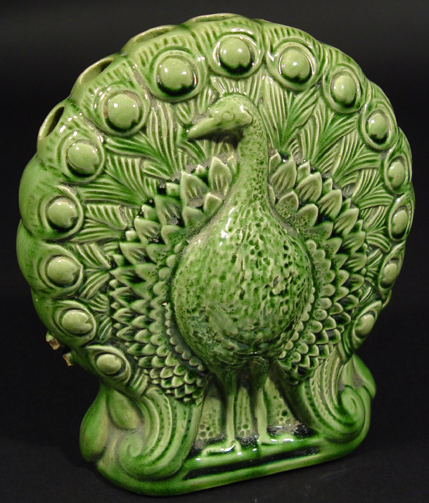 Appraisal: Ault pottery peacock spill vase with green glazed decoration factory