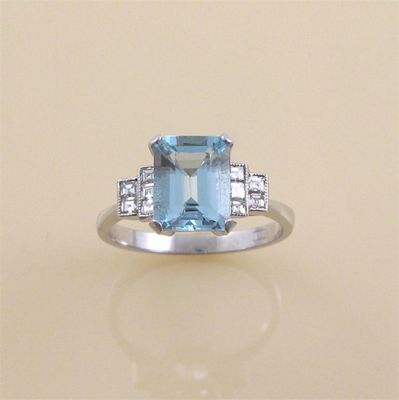 Appraisal: An aquamarine and diamond ring the step cut aquamarine is