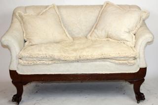 Appraisal: American tiger oak settee with paw feet American tiger oak