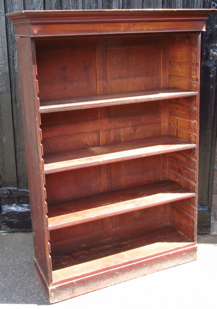 Appraisal: A late thC mahogany freestanding bookcase the rectangular over hanging