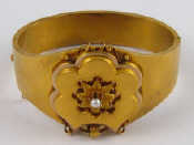 Appraisal: A Victorian carat gold bangle set with a seed pearl