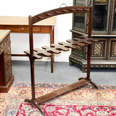 Appraisal: A George III mahogany boot rack circa the hooped top