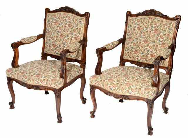 Appraisal: A PAIR OF FRENCH WALNUT OR BEECH OPEN ARMCHAIRS with