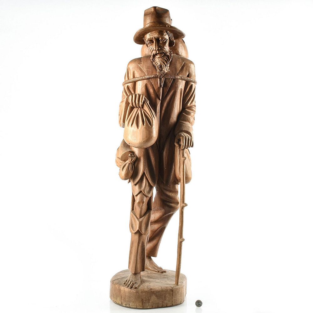 Appraisal: LARGE WOODEN SCULPTURE OF JOHNNY APPLESEED Traveling man planting apple