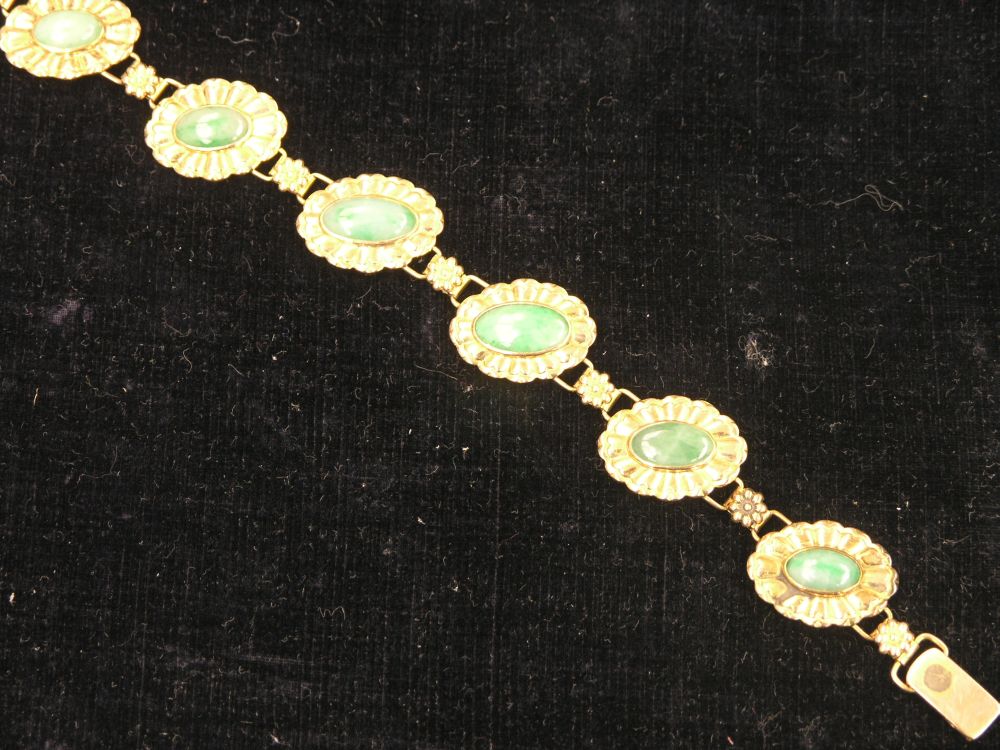 Appraisal: A ct gold and jade bracelet with interlinking rosettes -