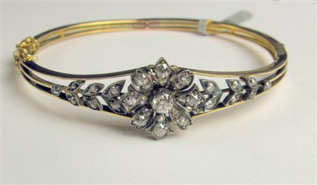 Appraisal: An Edwardian diamond set bangle of hinged design composed of